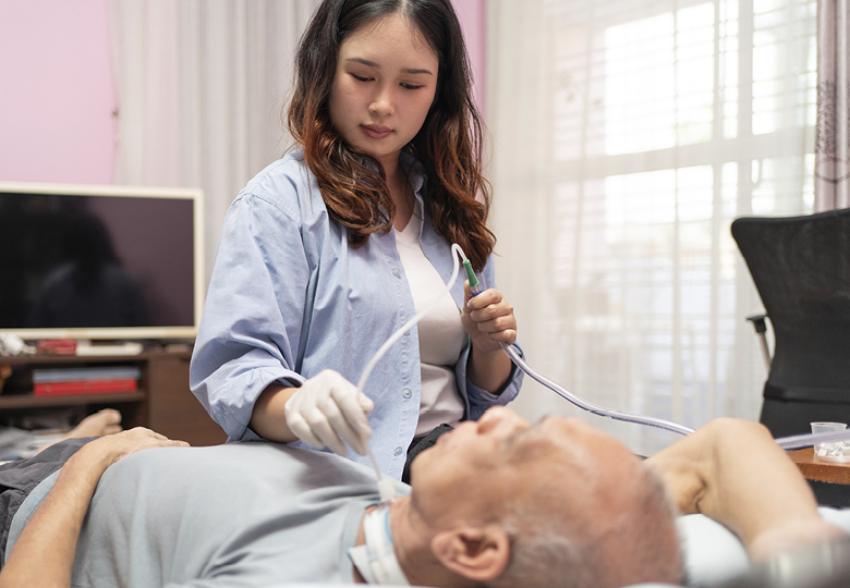 suction therapist working on patient